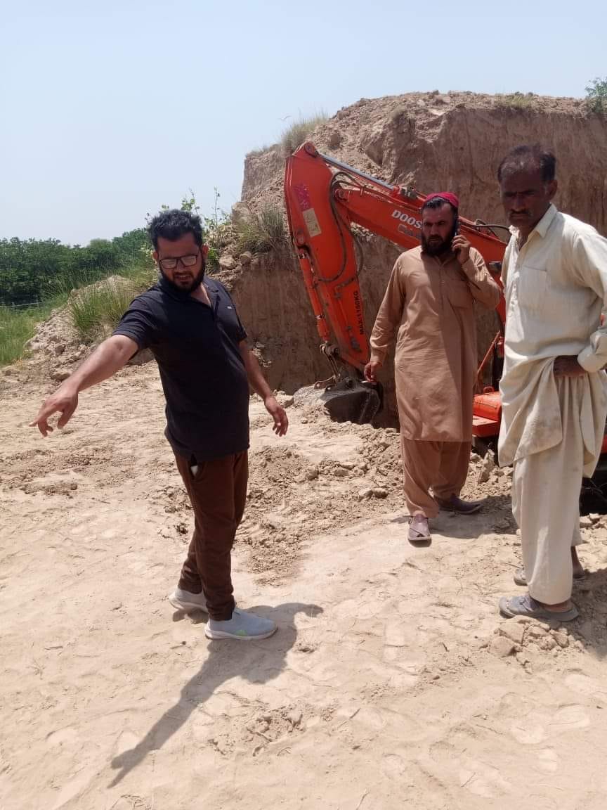 Engineer monitoring construction progress